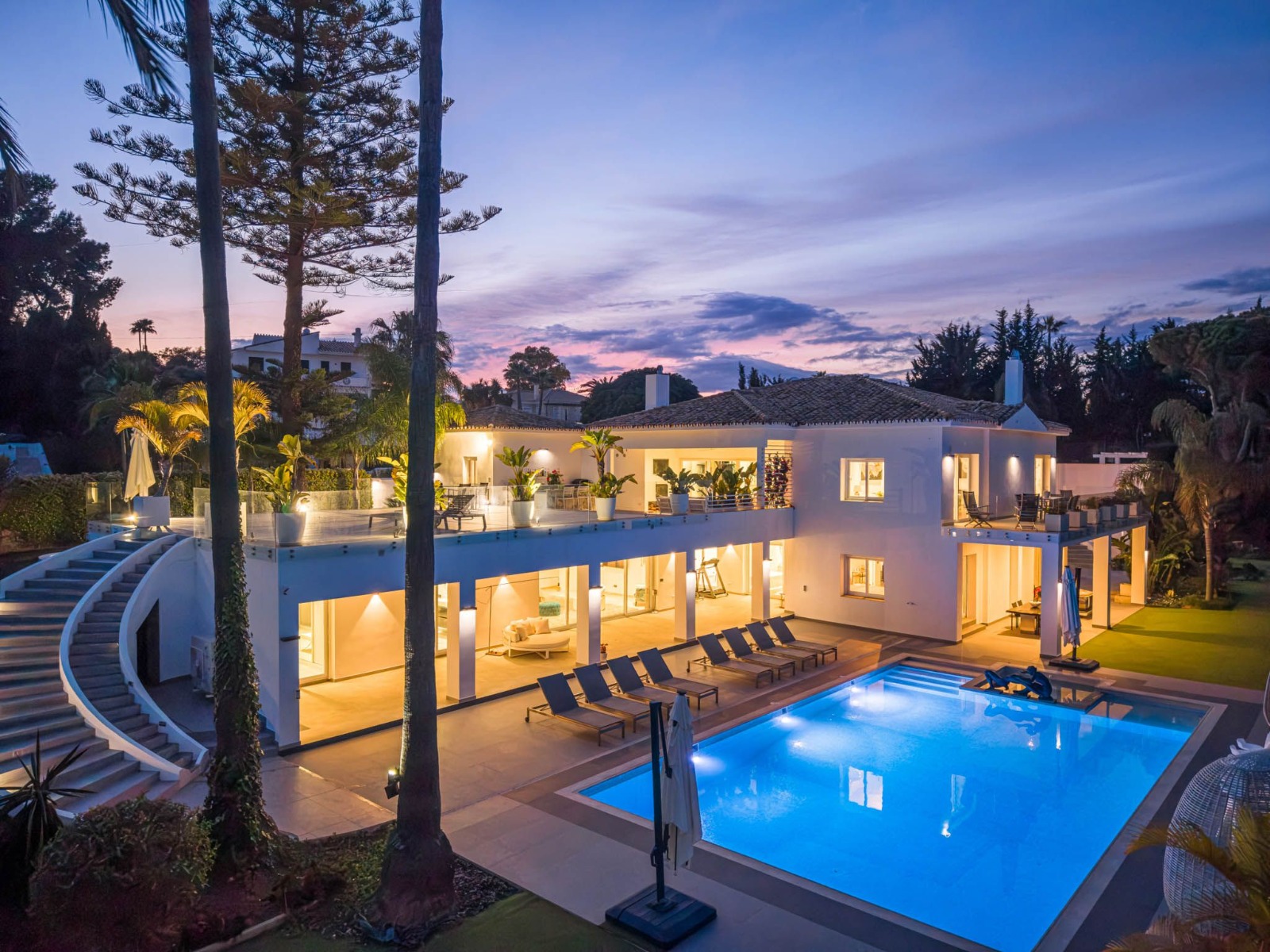 Contemporary villa and pool at evening